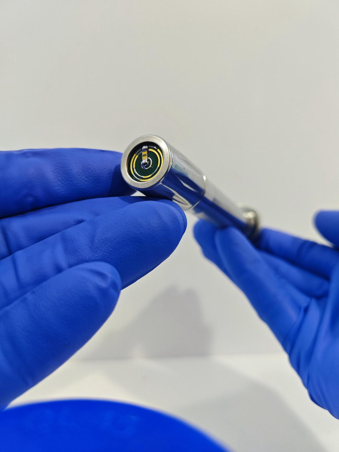 Cellcraft bioelectronic impedance sensor held by a laboratory researcher